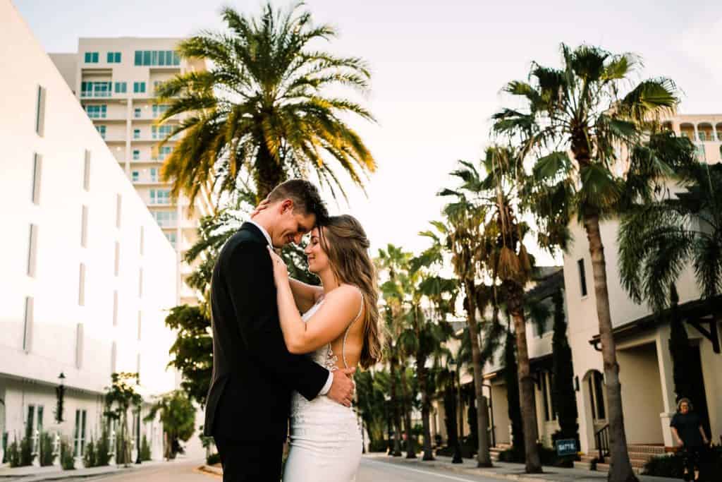 Couple hugging at a wedding in the Sarasota Modern by Sarasota wedding photographer