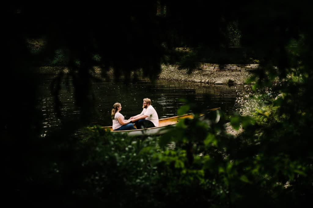 Couple on boat Hamstra Gardens engagement session
