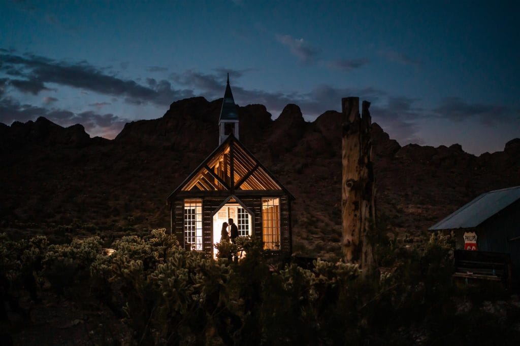 Couple silhouetted at a chapel for their elopement at El Dorado Canyon Mine.